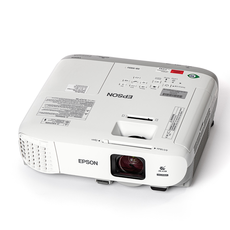 Weißer Epson-Beamer mit sichtbarer Linse und Bedienfeld auf der Oberseite, seitliche Lüftungsschlitze.